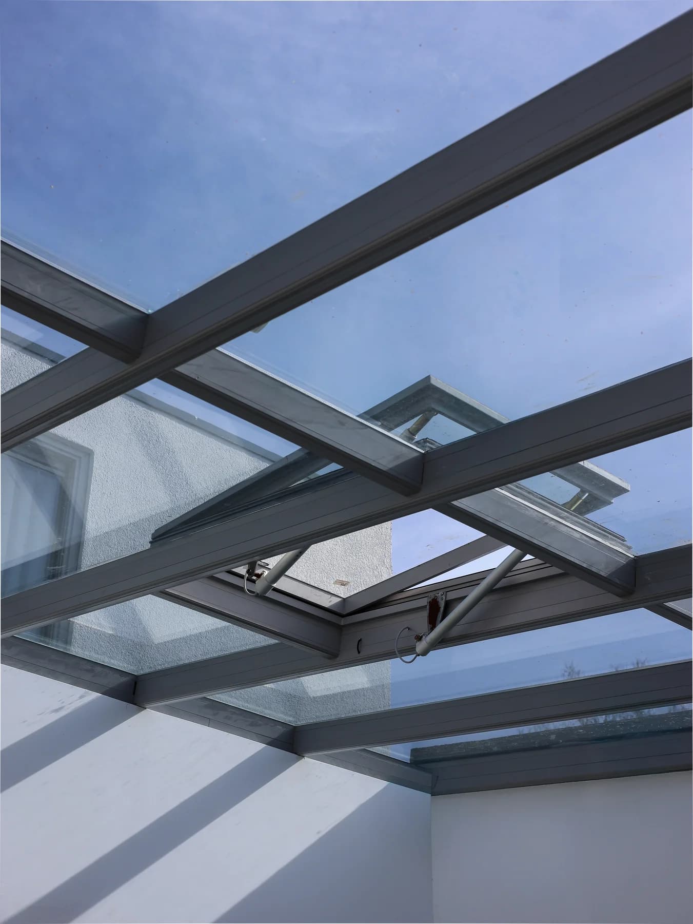 Glass roof with dark frames above the living space